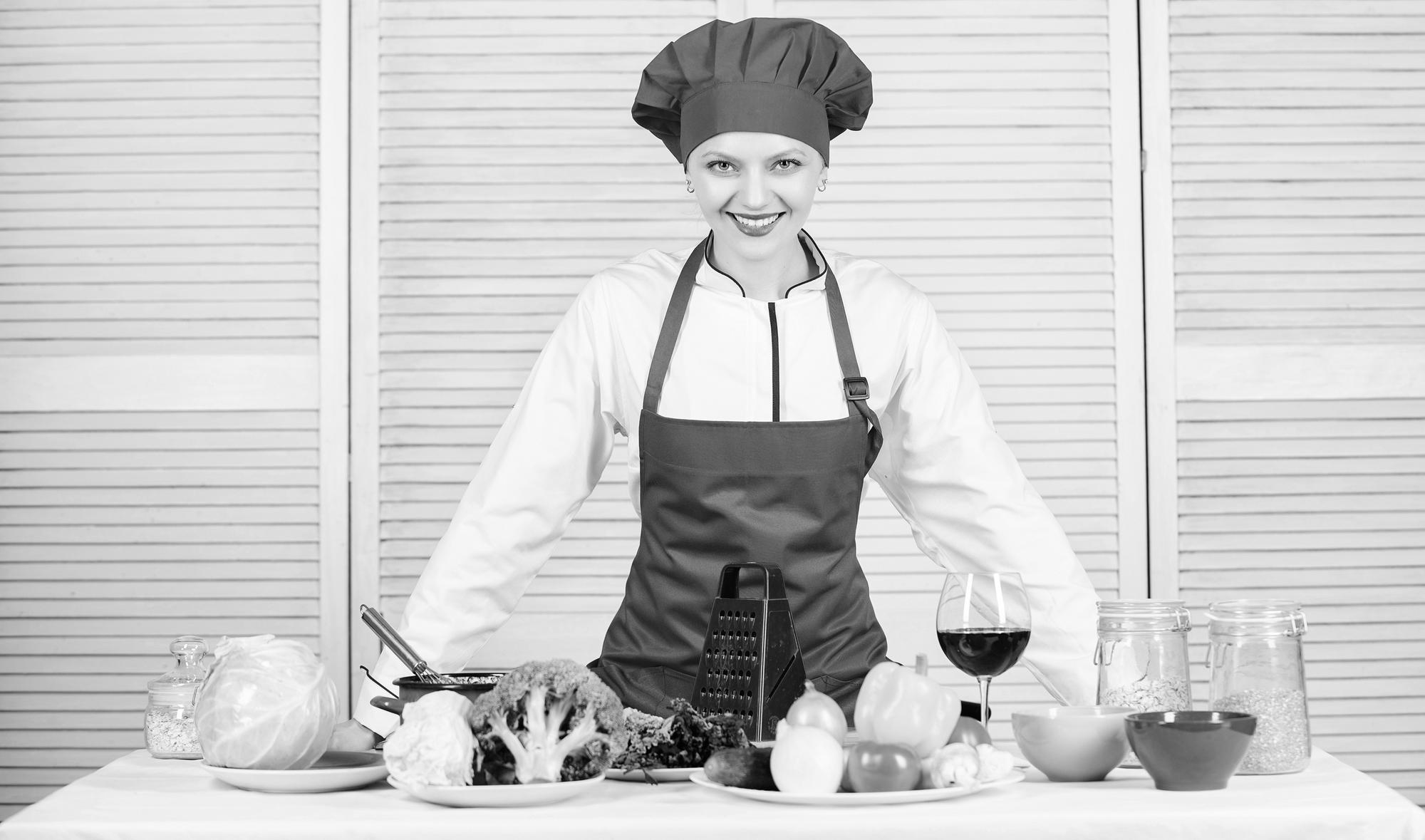 Small studio kitchen with chef at counter