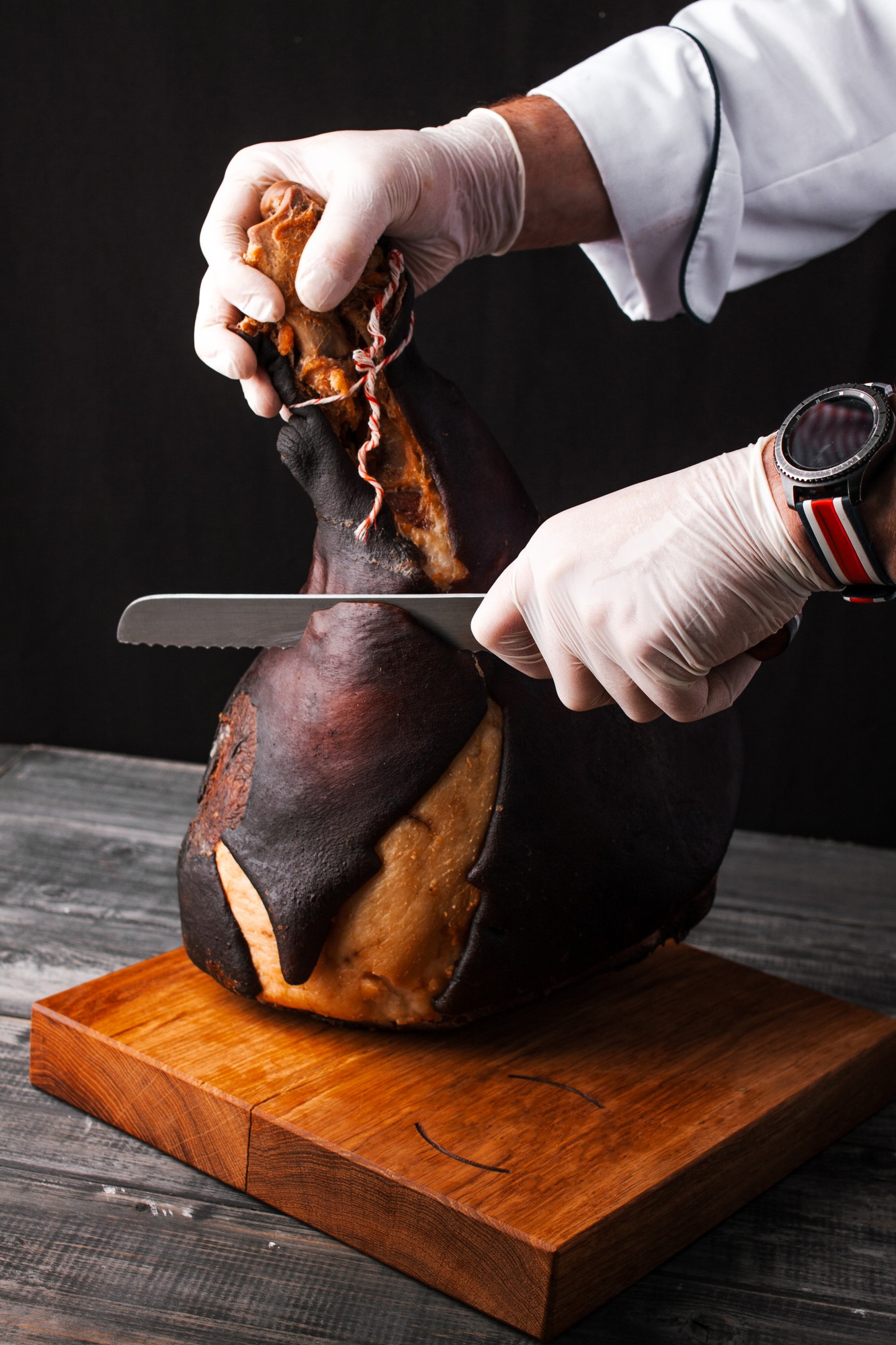 Chef hands carving roast