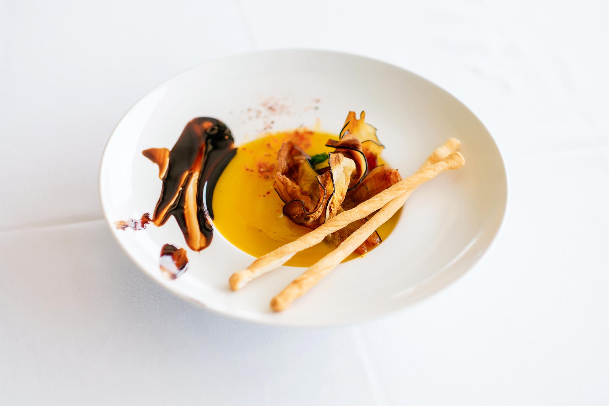 Chef arranging plated dish